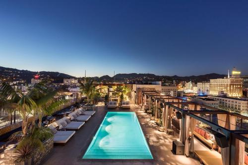a view of a swimming pool on top of a building at Dream Hollywood, by Hyatt in Los Angeles