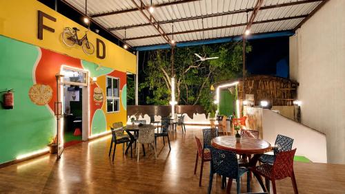a restaurant with tables and chairs in a room at Rajputana cafe and restaurant in Dausa
