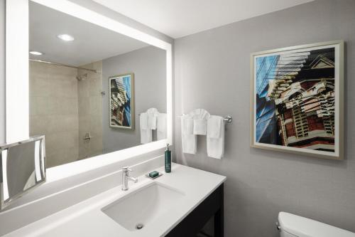 a bathroom with a sink and a mirror at Hilton Concord in Concord