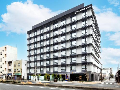 an office building on a city street at Comfort Hotel ERA Kyoto Toji in Kyoto