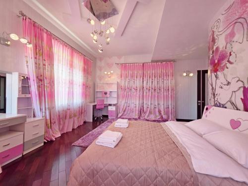 a bedroom with pink curtains and a large bed at Вілла з 6 Спальнями Басейн Більярд Сауна BBQ Укриття in Odesa
