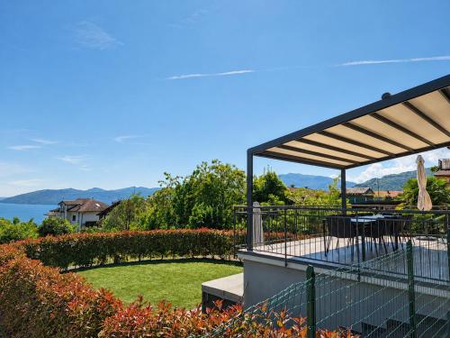 a patio with a table and a view of the water at Villa Spa Nipotine Casa Sorelle in Cissano