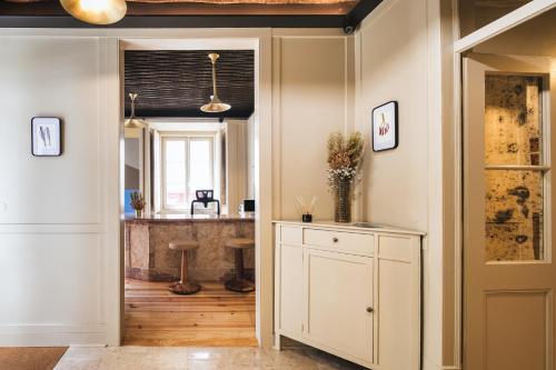 a hallway with a white cabinet and a counter at Pendoa Sintra Collection-Soft Opening in Sintra