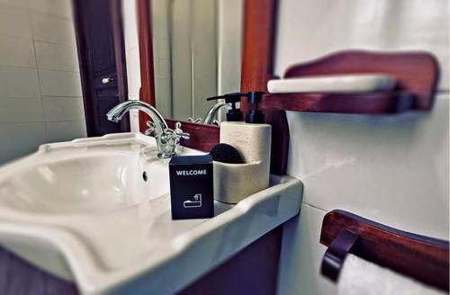 a bathroom with a sink and a mirror at Residence Oasi del Delta in Taglio di Po