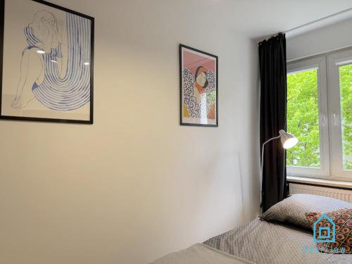 a bedroom with a bed and a window at Harbor Room at City Center Gdynia & Seaside in Gdynia