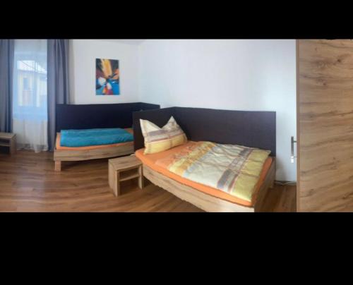 a living room with a bed and a couch at Haus Brandner Judenburg in Judenburg