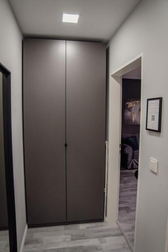 a sliding door in a room with a bedroom at Apartment Nr 11 in Bremerhaven