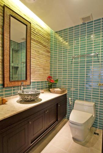 a bathroom with a sink and a toilet and a mirror at The Sea View Residence in Ban Bang Bao