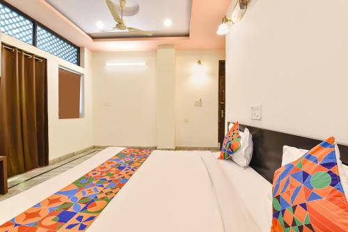 a bedroom with a bed in a room at FabHotel Moon Stone, Near Jawahar Circle - World Trade Park in Jaipur