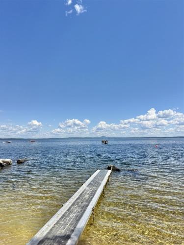 a dock in the middle of a large body of water at ROCKY BEACH LIMIT 5 cabin in Standish