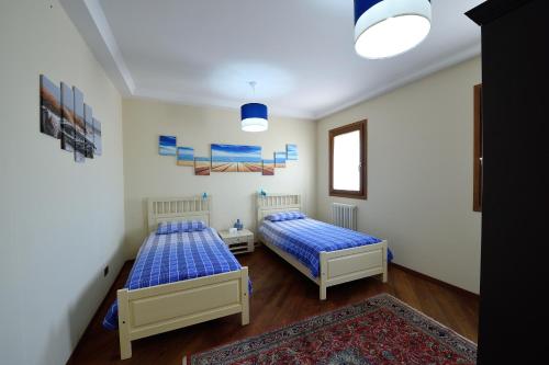 Postel nebo postele na pokoji v ubytování Ca' Dei Burci
