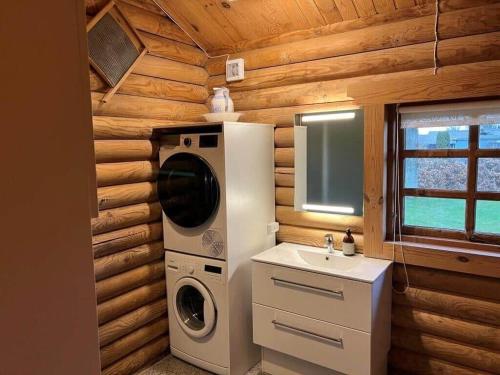 a kitchen with a washing machine and a sink at 30118-Odder-Pouli-Nielsensvej-27 in Odder