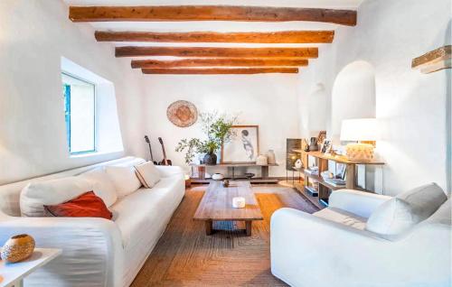 a living room with a white couch and a table at Ca'n Panxeta in Felanitx