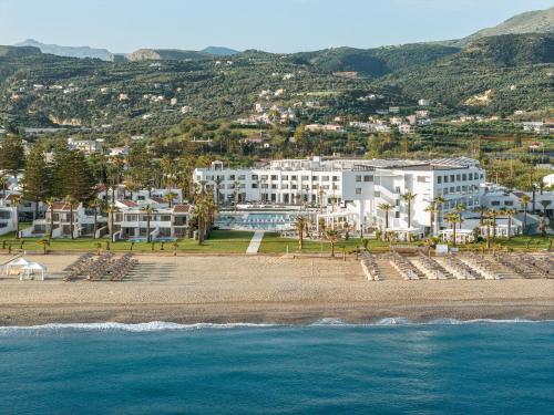 an aerial view of a resort on the beach at Creta Palace, A Resort to Live in Rethymno