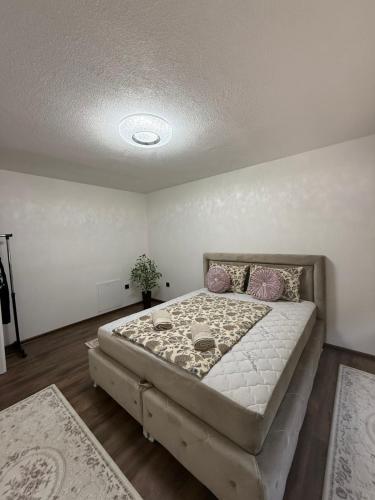a bedroom with a large bed in a room at EMRAH RIVER UNA in Bihać
