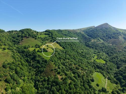 an aerial view of a forested area with a house at Casa Rural Istikot in Errazu
