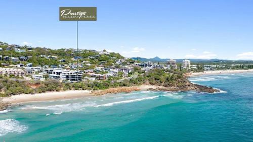 an aerial view of a beach with buildings and the ocean at Penthouse at First Bay Coolum in Coolum Beach