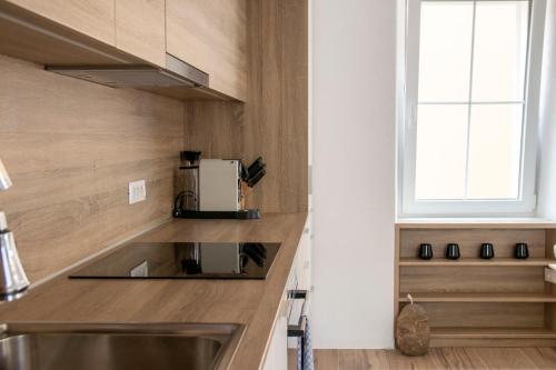 a kitchen with a sink and a window at Gloria Holiday - Villa di Istria in Piran