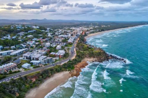 an aerial view of a beach and the ocean at Coolum First Bay 121 in Coolum Beach