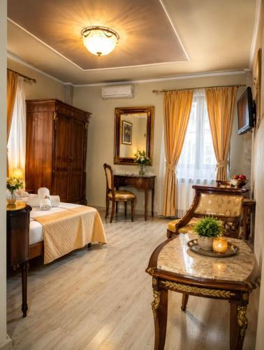 a hotel room with a bed and a table at Pensiunea Cardinal in Sibiu