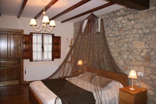 Postel nebo postele na pokoji v ubytování Trisileja en Posada La Busta
