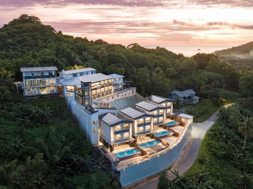 an aerial view of a house on a hill at Palau Mangrove Hotel in Koror
