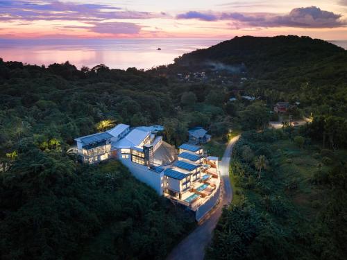 an aerial view of a house in the forest at Palau Mangrove Hotel in Koror