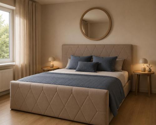 a bedroom with a large bed with a large mirror at Residenz Bergkristall in Saalbach-Hinterglemm