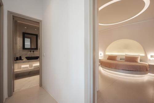 a bedroom with a bed and a bathroom at Galaria Serenity Suites in Vóthon