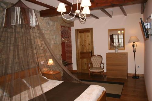 Postel nebo postele na pokoji v ubytování Trisileja en Posada La Busta