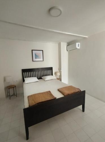 a bedroom with a large bed in a room at Casa Medusa fun in Cullera