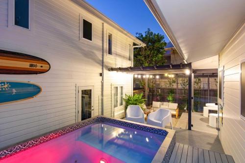 a swimming pool in the backyard of a house at La Mer in Marcoola in Marcoola