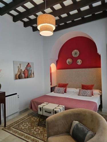 Llit o llits en una habitació de La Gitanilla Alojamiento & Encanto Jerez