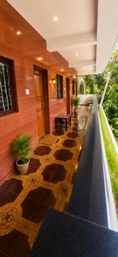 a lobby of a building with a tiled floor at selfia guest house in Majorda