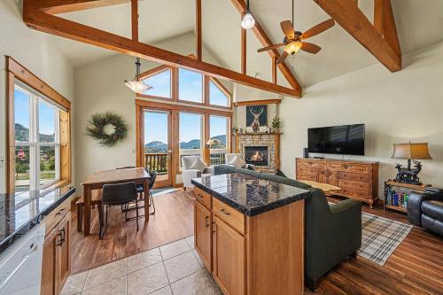 a kitchen and living room with a couch and a table at Jackstraw Mountain 32 in Estes Park