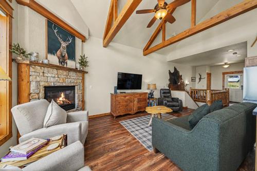 a living room with a couch and a fireplace at Jackstraw Mountain 32 in Estes Park