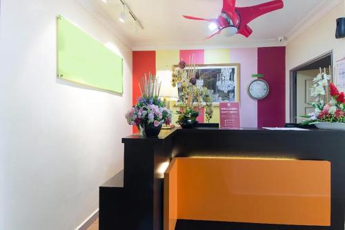a flower shop with colorful walls and a ceiling fan at Hotel Sunjoy9 Bandar Sunway in Petaling Jaya