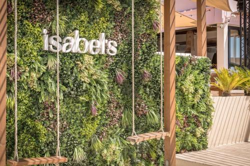 a vertical garden with the words salads on a wall at CP Seafront Suites in Laganas