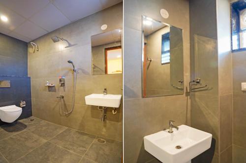 a bathroom with a sink and a shower and a toilet at FabHotel Golden Stay I in Bangalore