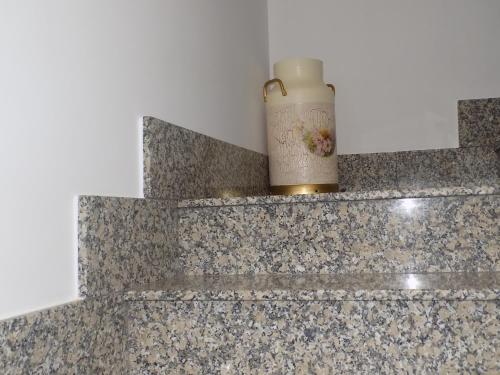 a candle sitting on top of a counter at El Capricho in Sotoserrano