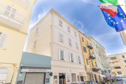 a building on a city street with a flag at Anzio Central Apartments in Anzio