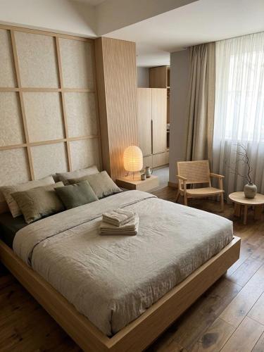 a bedroom with a large bed in a room at Apartments Belgrade in Belgrade
