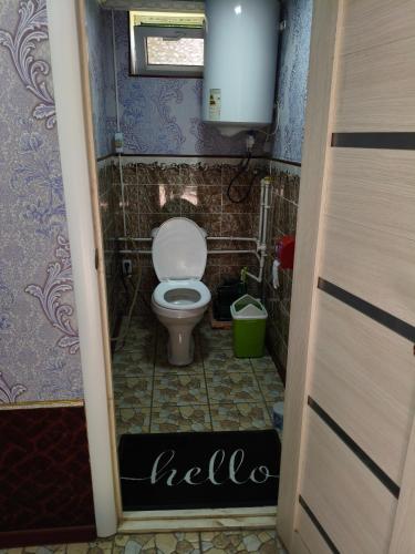 a small bathroom with a toilet in a room at Geust house Paradise in Arslanbob