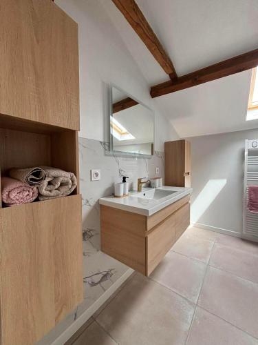 a kitchen with a sink and a counter top at Gîte La Vielle Forge in Virazeil
