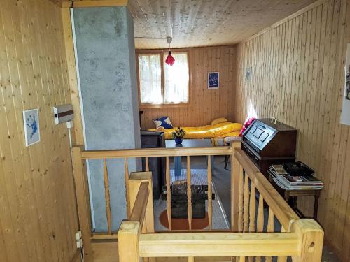 a room with a staircase and a bed in a room at Chalet Le Châtelaret by Interhome in Finhaut