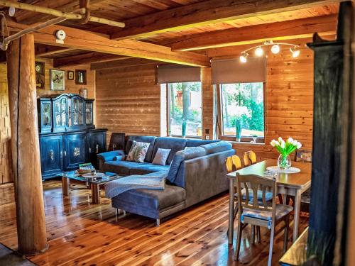 a living room with a couch and a table at Chalet Chata Ujo by Interhome in Hranice
