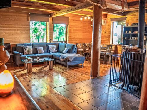 a living room with a couch and a table at Chalet Chata Ujo by Interhome in Hranice