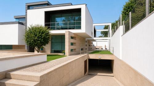 a house with a walkway leading up to it at Moradia Lux RR com piscina in Penafiel