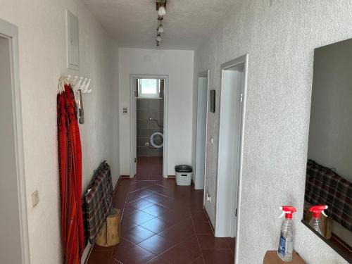 a room with a bathroom with a toilet and a tile floor at Apartment Dorada in Dobra Voda