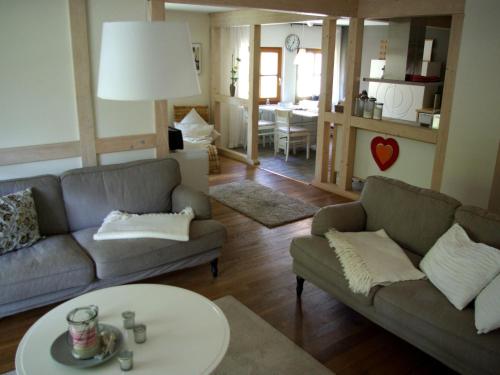 a living room with two couches and a table at Apartment Waldblick by Interhome in Bleckede